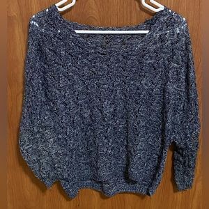 Knit-like material, dark blue and white long-sleeved sweater.